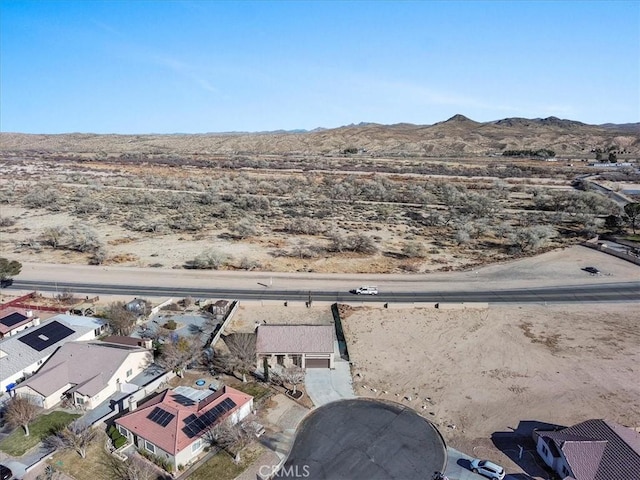 aerial view with a residential view, a mountain view, and a desert view