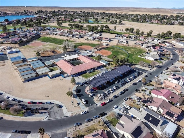 birds eye view of property with a residential view and a water view