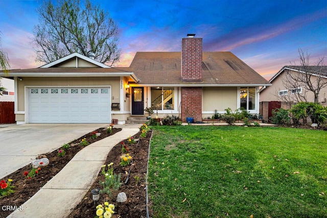 view of front facade with driveway, a chimney, an attached garage, fence, and a front lawn