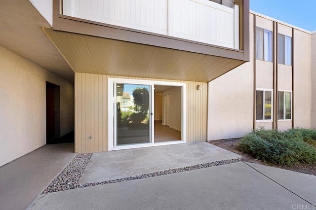 entrance to property with a patio area