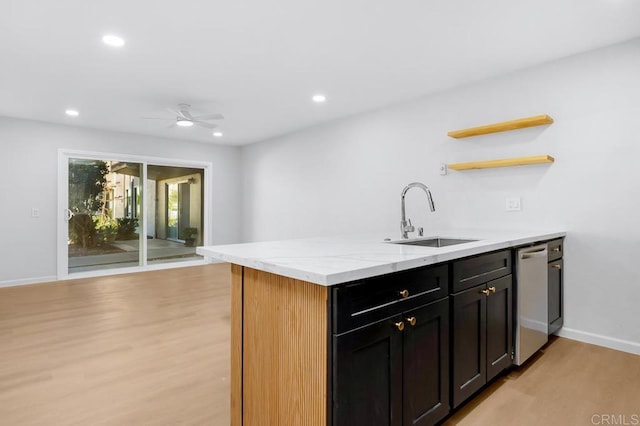 kitchen featuring a sink, open shelves, stainless steel dishwasher, recessed lighting, and light wood finished floors