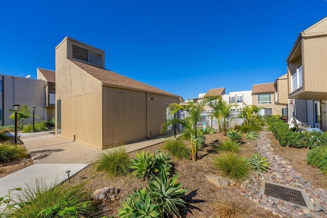 exterior space with fence and a residential view