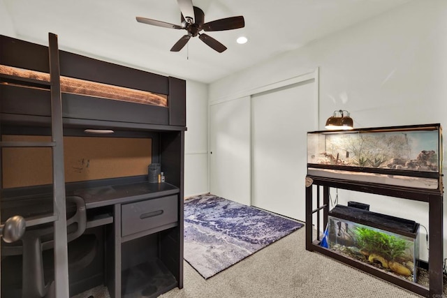 carpeted bedroom featuring a ceiling fan, a closet, and recessed lighting