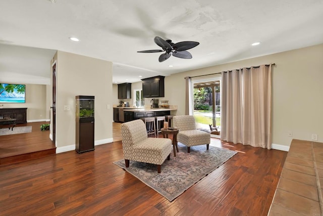 sitting room featuring dark wood-style flooring, recessed lighting, a ceiling fan, and baseboards