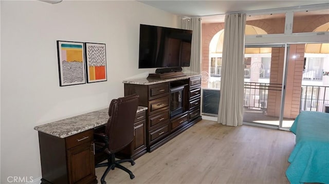 office featuring a wealth of natural light and light wood-style flooring