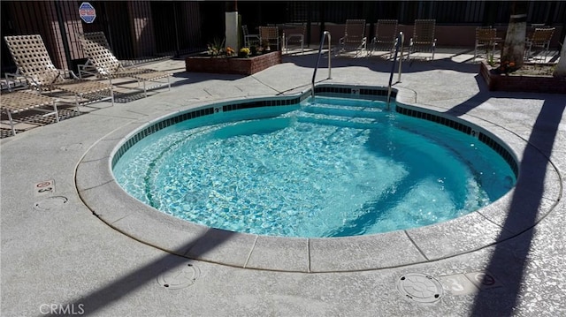 view of pool with fence and a patio