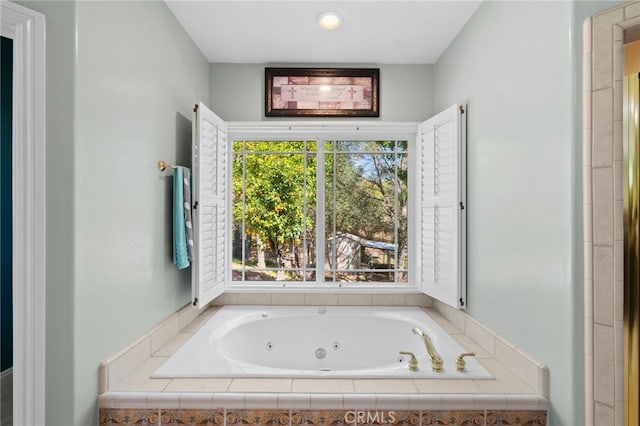 bathroom featuring a tub with jets