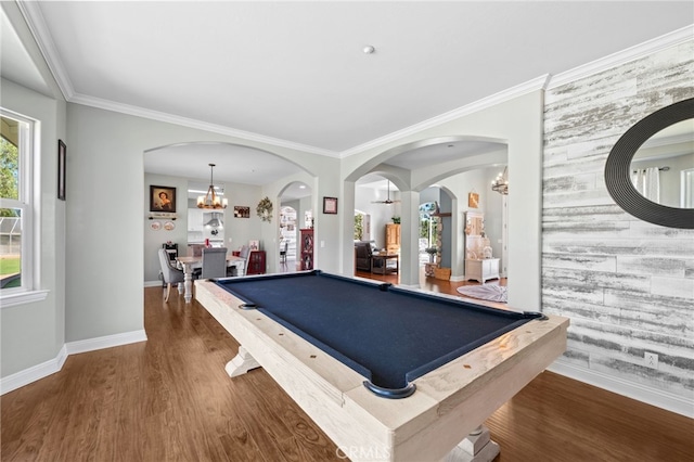 recreation room featuring a notable chandelier, ornamental molding, wood finished floors, billiards, and baseboards