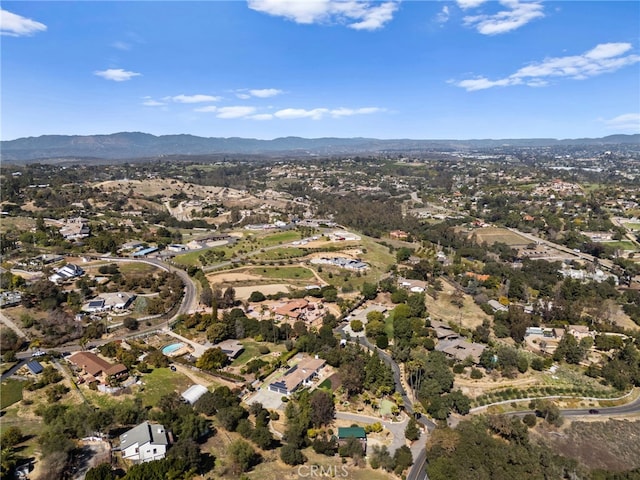 birds eye view of property featuring a mountain view