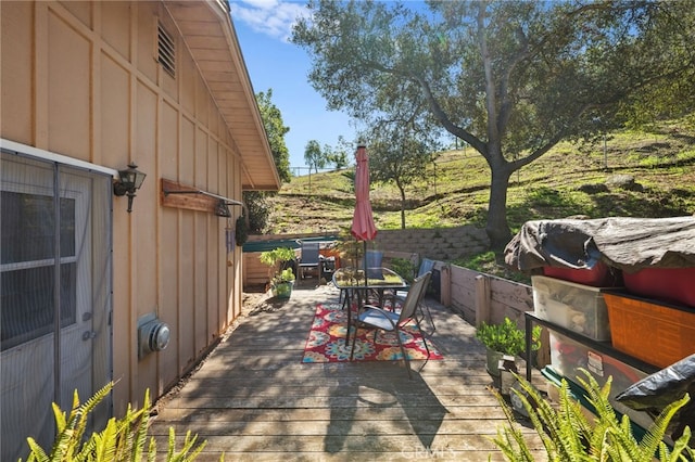 view of patio / terrace with a deck and outdoor dining area