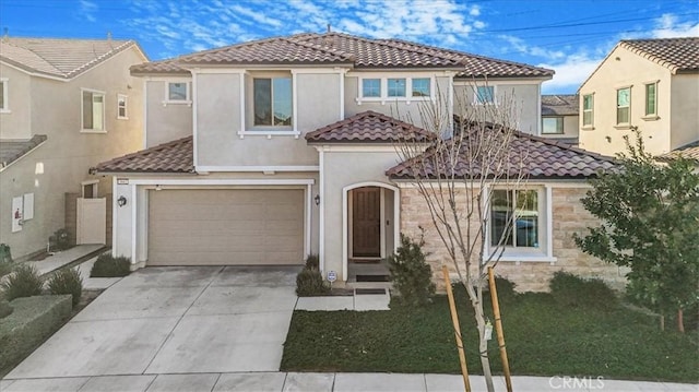 mediterranean / spanish-style house featuring driveway, stucco siding, a garage, and a tiled roof