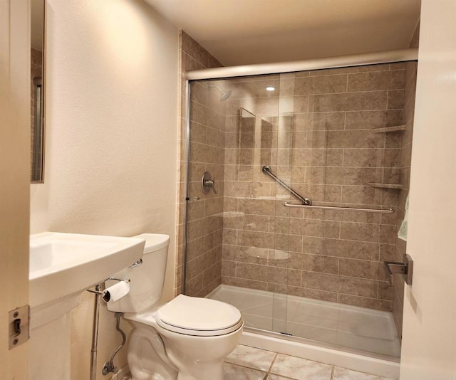 full bathroom featuring a stall shower and toilet