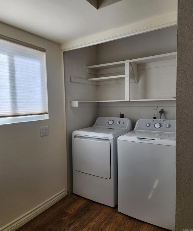 washroom with laundry area, separate washer and dryer, dark wood finished floors, and baseboards