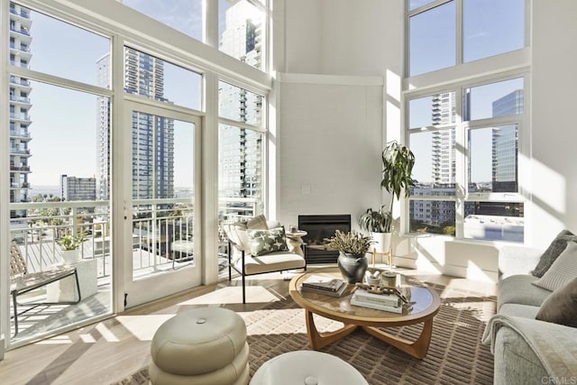 sunroom / solarium with a view of city and a glass covered fireplace