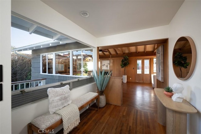 entrance foyer with beam ceiling and wood finished floors