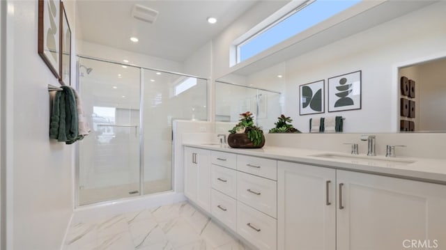 full bath featuring a sink, visible vents, marble finish floor, double vanity, and a stall shower