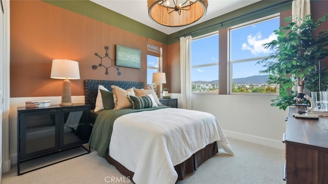 bedroom with carpet floors and baseboards