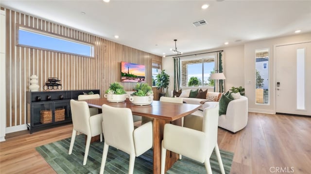 dining space with light wood-type flooring, visible vents, baseboards, and recessed lighting