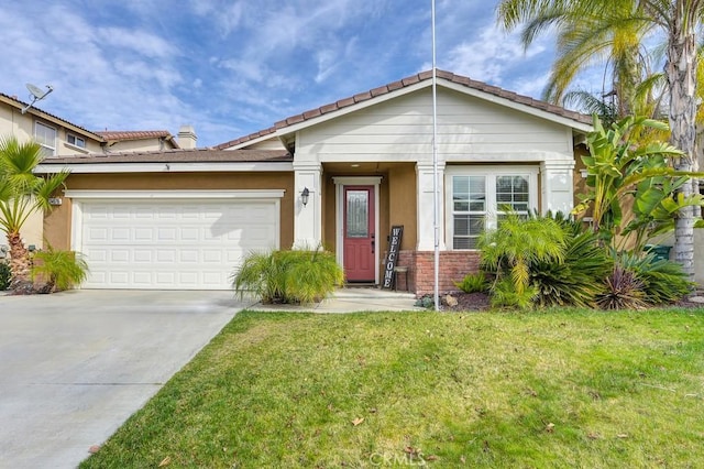 view of front of property featuring a garage, a front lawn, concrete driveway, and stucco siding