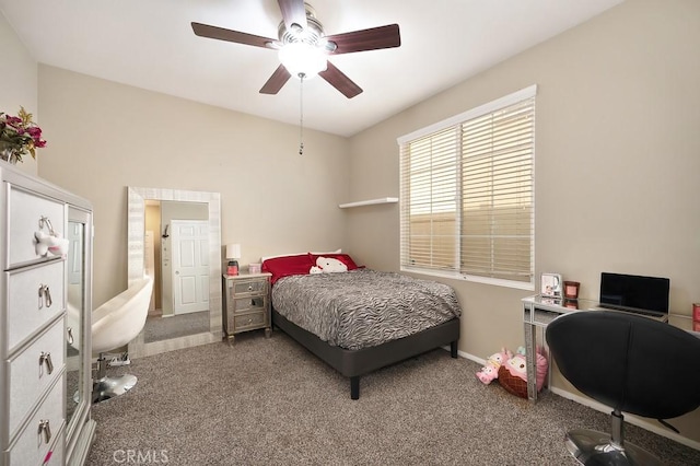 carpeted bedroom with baseboards and a ceiling fan