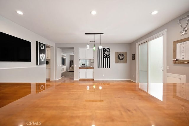 unfurnished dining area with recessed lighting