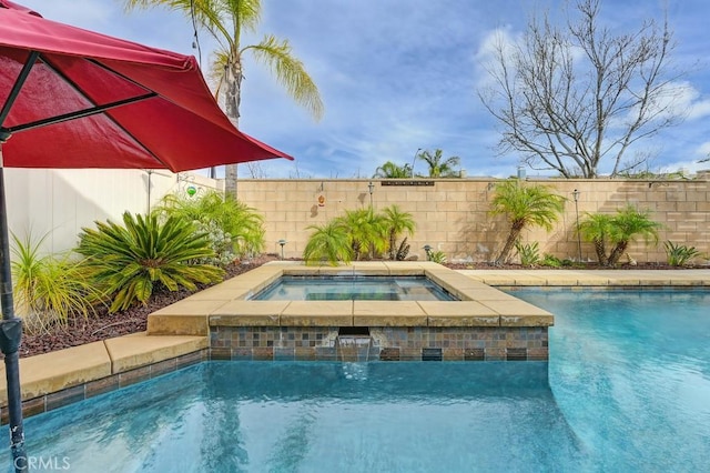 view of swimming pool featuring a fenced in pool, a fenced backyard, and an in ground hot tub