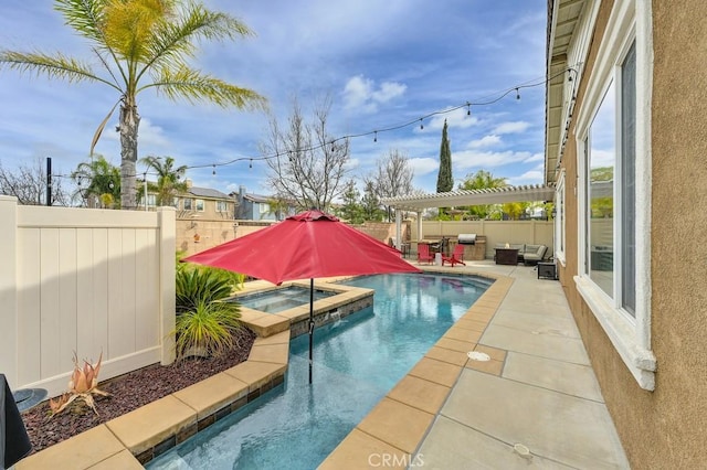 view of pool with a patio, a fenced backyard, a pool with connected hot tub, and a pergola