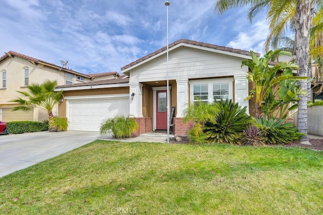 view of front of home featuring a garage, stucco siding, concrete driveway, and a front yard