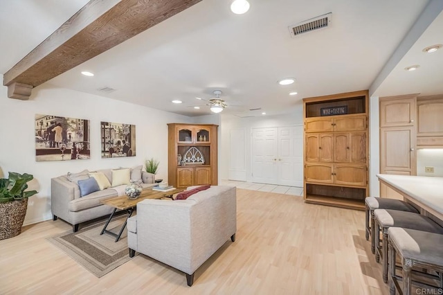 living room featuring light wood finished floors, visible vents, a ceiling fan, and recessed lighting