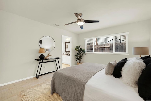 bedroom featuring visible vents, baseboards, connected bathroom, light wood-style flooring, and ceiling fan