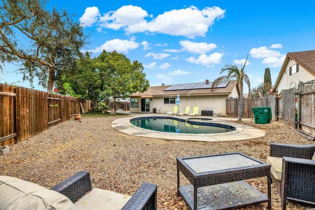 view of pool featuring a patio area, a fenced backyard, and a fenced in pool