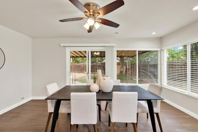 dining area with a ceiling fan, recessed lighting, baseboards, and wood finished floors