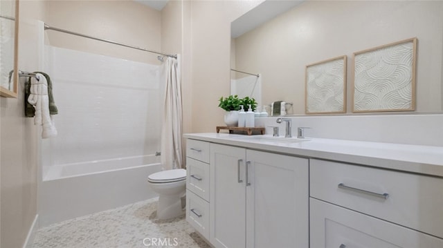 full bath featuring shower / bath combo with shower curtain, vanity, and toilet