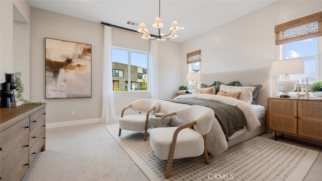 bedroom featuring light carpet, visible vents, baseboards, and a notable chandelier