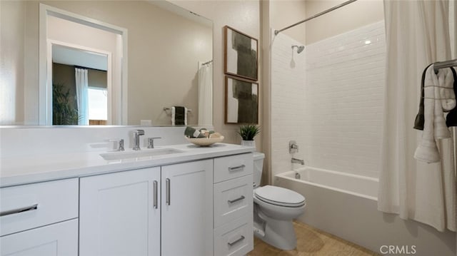 full bathroom with vanity, toilet, and shower / bath combo with shower curtain