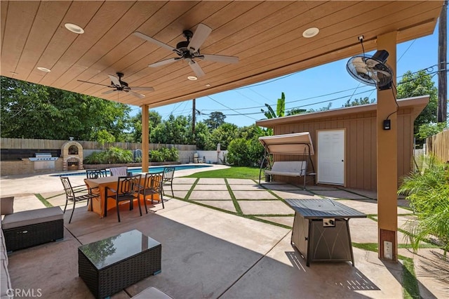 view of patio featuring ceiling fan, a fenced backyard, outdoor dining area, and a fenced in pool