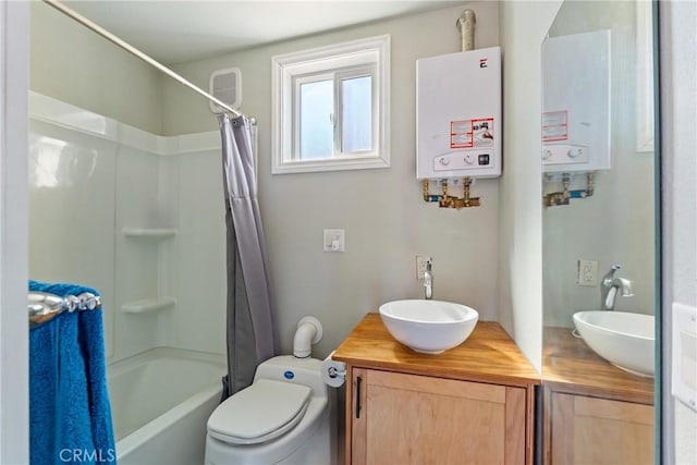 bathroom with double vanity, water heater, and a sink