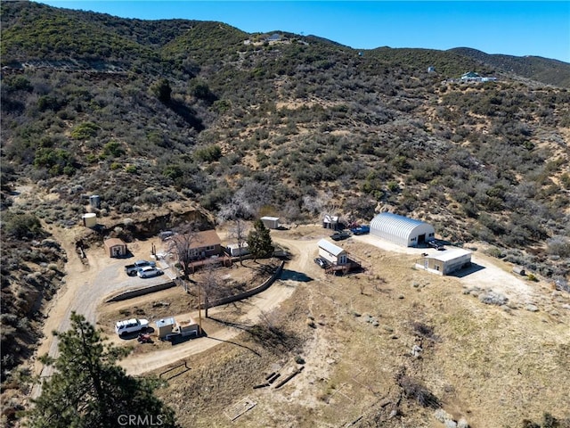 birds eye view of property featuring a mountain view