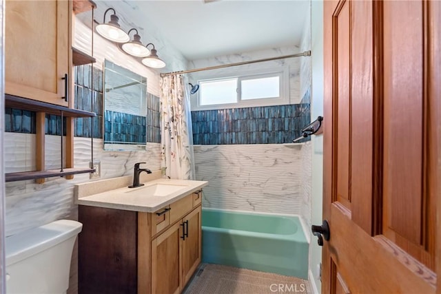 bathroom featuring tile walls, toilet, shower / tub combo with curtain, vanity, and backsplash