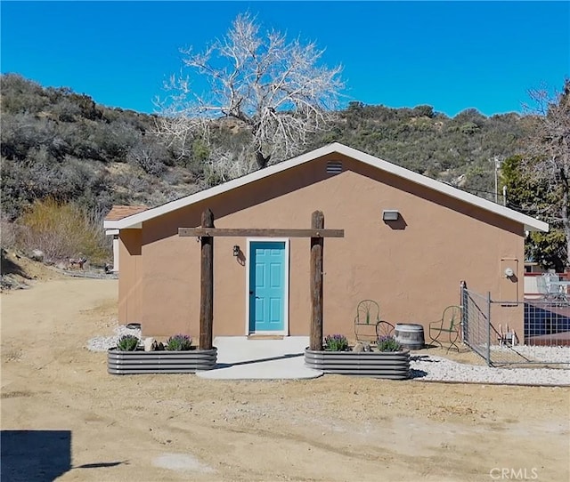 back of property with stucco siding