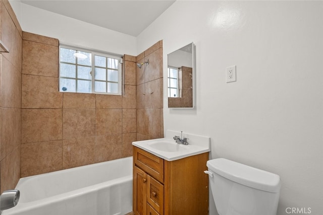 bathroom featuring toilet, shower / bath combination, and vanity