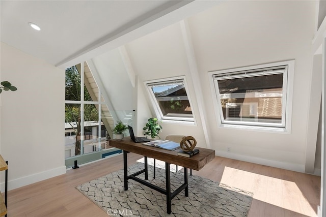 office featuring light wood-style floors, recessed lighting, vaulted ceiling with beams, and baseboards