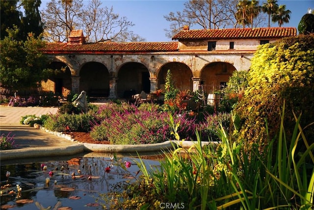 exterior space with a tiled roof