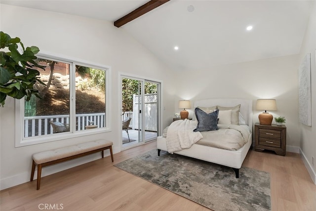 bedroom featuring access to exterior, baseboards, beam ceiling, and wood finished floors