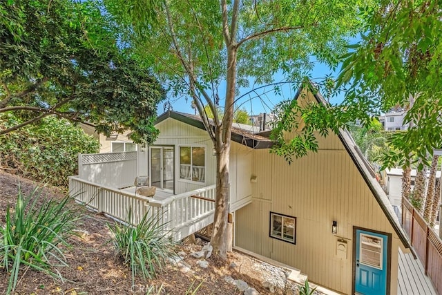 rear view of property with a deck