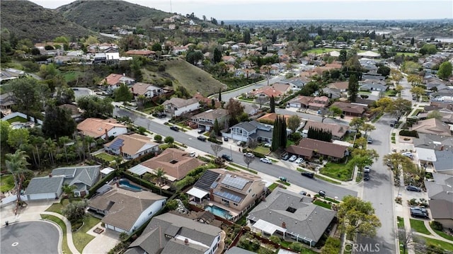 drone / aerial view with a residential view and a mountain view