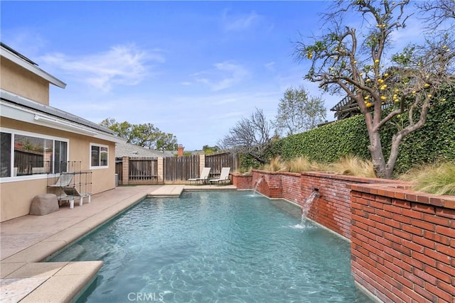 view of pool with a patio, fence, and a fenced in pool