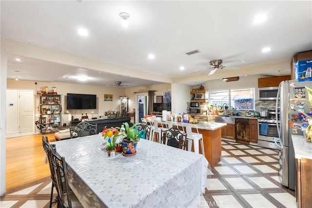 dining room with recessed lighting, visible vents, and ceiling fan