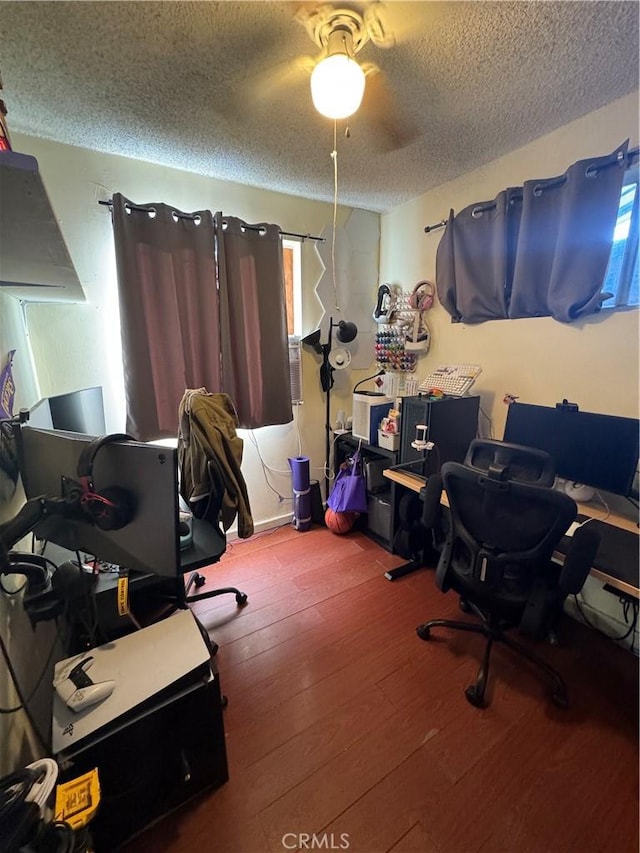 office with a textured ceiling and hardwood / wood-style floors