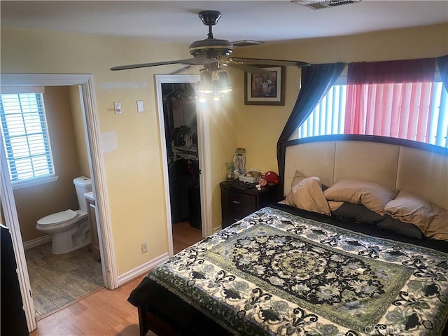 3158 E E Ave H8, Lancaster, CA 93535 - bedroom featuring a closet, a walk in closet, light wood finished floors, ensuite bath, and ceiling fan